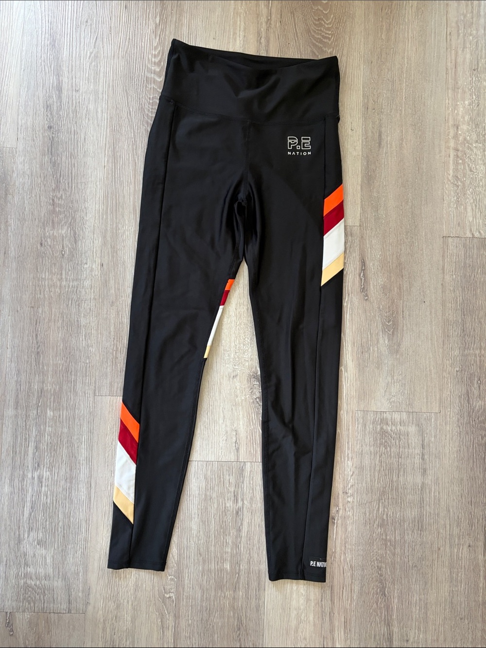 P.E Nation Black Leggings with Red, Orange, White & Tan Stripe Panels
